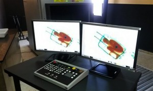 In this photo released by the Spanish Guardia Civil on Friday, May 8, 2015, a boy curled up inside a suitcase is seen on the displays of a scanner at the border crossing in Ceuta, a Spanish city enclave in North Africa. A Spanish court has ordered the detention of a father who allegedly hid his 8-year-old son inside a closed suitcase in an attempt to smuggle the child illegally into Europe. A police statement said guards stopped a 19-year-old Moroccan woman who looked nervous as she waited in line Thursday at the land border crossing in Ceuta (AP Photo/Spanish Interior Ministry, via AP)