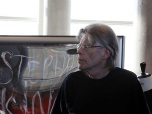 American author Stephen King arrives for an autograph session with fans during a promotional tour in France for his last book "Doctor Sleep" at a library in Paris, Wednesday Nov. 13, 2013. "Doctor Sleep" is a sequel to King's 1977 novel The Shining, released in September 2013. (AP Photo/Francois Mori)